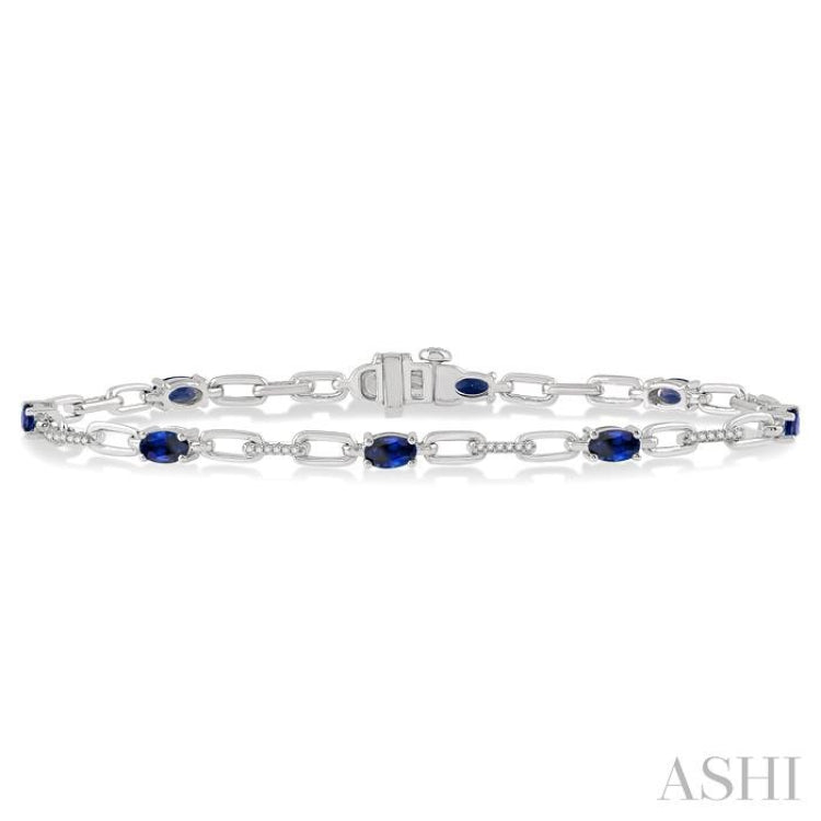 5x3 MM Oval Cut Sapphire and 1/6 Ctw Round Cut Diamond Precious Bracelet in 10K White Gold