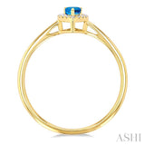 5x3 MM Pear Shape Blue Topaz and 1/20 ctw Single Cut Diamond Halo Semi Precious Ring in 10K Yellow Gold