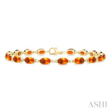 6X4 MM Oval Cut Citrine and 1/6 ctw Round Cut Diamond Semi Precious Tennis Bracelet in 10K Yellow Gold