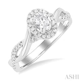 1/2 ctw Twisted Shank Round Cut Diamond Halo Engagement Ring With 1/3 ct Oval Cut Diamond Center Stone in 14K White Gold